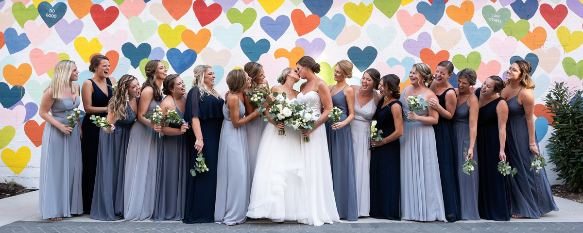 same sex wedding photographer confetti hearts wall